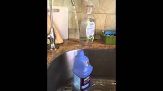 Removing cap from Swiffer Wet Jet and replacing it with Thieves non toxic cleaner [upl. by Nadirehs]