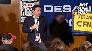 Climate protester tackled while trying to invade Ron DeSantis presidential campaign event [upl. by Bock205]