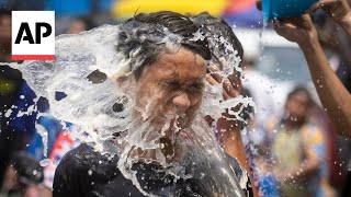 Thailand kicks off Songkran festival celebrating new year with street water fights [upl. by Nehtanhoj]