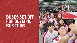 Buses leave OCBC Square for Team Singapore opentop bus parade around Singapore [upl. by Oliviero]