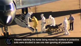 Clipboard man spotted not wearing Ebola suit near patient at Dallas airport [upl. by Amliw985]