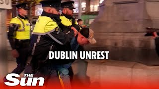 Unrest grips Dublin after stabbing Heavy police presence as clashes continue [upl. by Ahsenrat133]