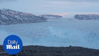 Monstrous iceberg seen breaking off Greenland glacier [upl. by Nosyk]