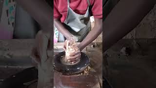 student practicing how to center clay on the potters wheel pottery [upl. by Gariepy221]