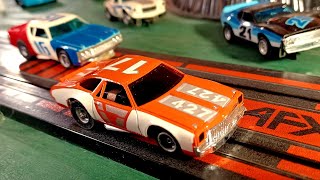 Auto World XTraction vs AFX MagnaTraction HO Slot Cars Race [upl. by Anwahsiek]