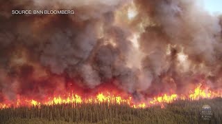 Raging Wildfires Burn Across Canada Sending Smoke Down to the US [upl. by Annayk]