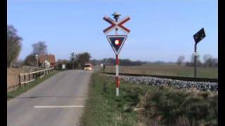 A Danish IC3 train passes railroad crossing nearby Radbjerg [upl. by Colville]