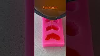 Person is creating gel wax mandarin slices for candle decorations [upl. by Atteuqram]