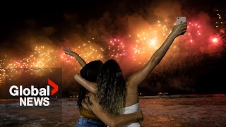 New Years 2023 Copacabana beach sizzles in Rio de Janeiro as fireworks illuminate night sky [upl. by Nivej]