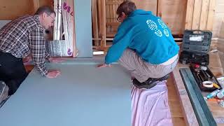 Plasterboarding the log cabin walls Day one moisture resistant board in bathroom [upl. by Alle736]