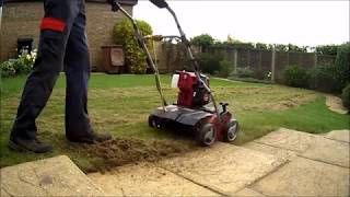 SCARIFYING MOSS AND THATCH OUT OF A SMALL LAWN [upl. by Etam950]