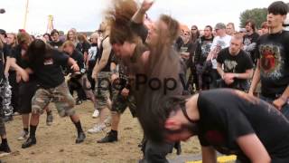 Mid Panning Shot Heavy metal fans mosh head bang and da [upl. by Yrekcaz]