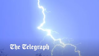 UK weather Dramatic thunderstorms light up night sky above London as flood warnings issued [upl. by Eiramlatsyrk]