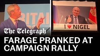 Nigel Farage pranked with Putin banner during speech [upl. by Sisi]