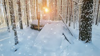 Winter shelter in the wild forest 30 °C inside Cooked dinner on the stove New bed ready [upl. by Fortna684]