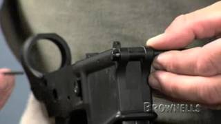 Brownells  AR15 Installing the Pivot Pin [upl. by Enoryt]