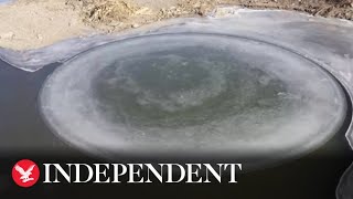 Tourists flock to witness rare ice disk in China [upl. by Nalniuq482]