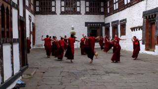 Dancing buddhist monks in Trongsa Dzong Bhutan [upl. by Anstice]