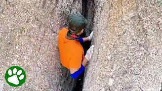 Brave man climbs down narrow ravine after hearing cries for help [upl. by Dori]