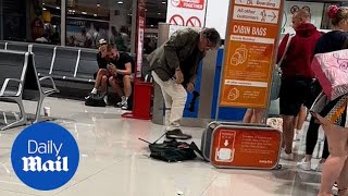 EasyJet passenger destroys his luggage to avoid excess baggage fee [upl. by Ajuna52]