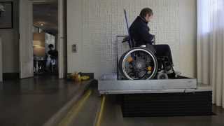 Stepless by Guldmann LP50H wheelchair lifting platform  Going Down [upl. by Caves]