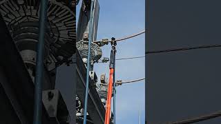 Grounding a high voltage wire with induction substation electrical maintenance [upl. by Ennovehc224]