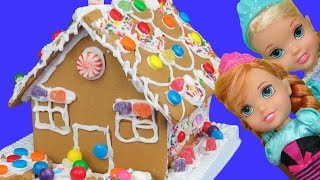 Gingerbread house BUILDING  ELSA ANNA toddlers use icing and candy [upl. by Daniel415]