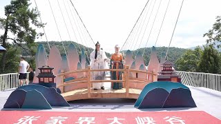 Celebrations held for Qixi Festival on glass bridge in Chinas Zhangjiajie [upl. by Ykcim]