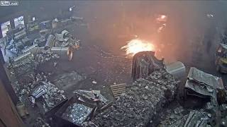 Foundry worker puts wet scrap metal in furnace [upl. by Maharba211]