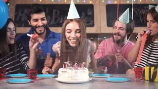 Woman Blows Birthday Candles Stock Video [upl. by Halac140]