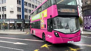 Translink Metro buses passing Belfast City Hall [upl. by Oinotnanauj]