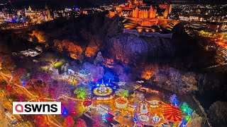 Edinburghs Christmas market and castle lit up with festive cheer  SWNS [upl. by Norel]