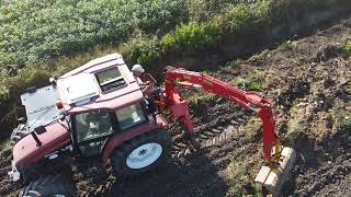 How a ditch is dug with a tractor and excavator arm with New Holland L85 excavator Negrisolo [upl. by Loyce805]