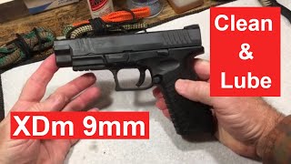 How to Clean a Springfield XDm 9mm semiautomatic pistol Disassemble clean lube and reassemble [upl. by Anoyet]