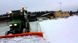 Snowplowing with John Deere 3720 [upl. by Eyssej]