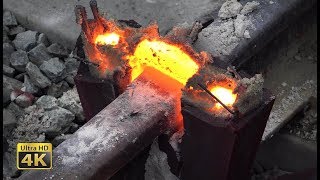 Rails thermite welding  Eruptions melt squeezing and grinding 4K [upl. by Hgielyak]