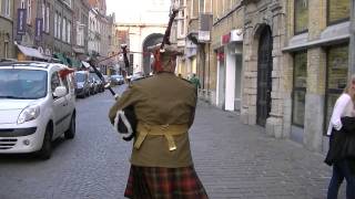 Marching with the Bagpipes toward the Menin Gate Ypres [upl. by Elitnahc]