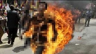 Tibetan protester sets himself on fire ahead of China Presidents visit to Delhi [upl. by Aleyam160]