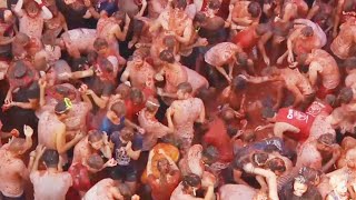 Food Fight 20000 People Toss Tomatoes at Spains La Tomatina [upl. by Michale309]