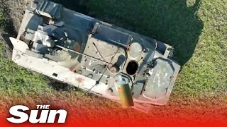 Russian tank explodes as Ukrainian drone drops bomb into open hatch [upl. by Dlonyer805]