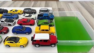 Tiny Diecast Model Cars Sliding Down Into The Water [upl. by Ibur]