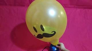 YELLOW SMILEY MUSTACHE FACE BALLOON POPS IN SLOW MOTION [upl. by Sanderson]