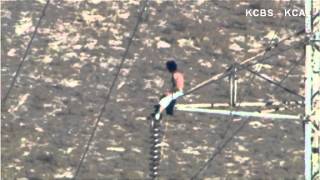 Man Climbs Power Line Tower [upl. by Graniah]