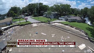 Massive sinkhole swallows two homes [upl. by Olegnaleahcim780]